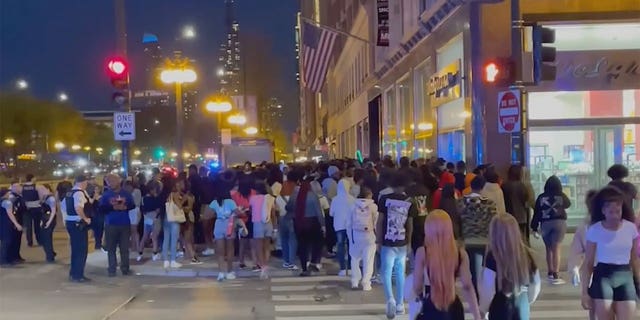 Teens spilled into downtown Chicago, smashing car windows and attacking tourists.