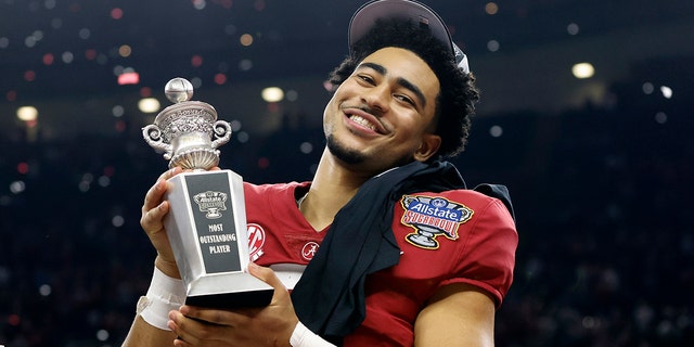 Alabama quarterback Bryce Young holds the Most Outstanding Player trophy as he celebrates after the Sugar Bowl NCAA college football game where Alabama defeated Kansas State 45-20, Saturday, Dec. 31, 2022, in New Orleans.