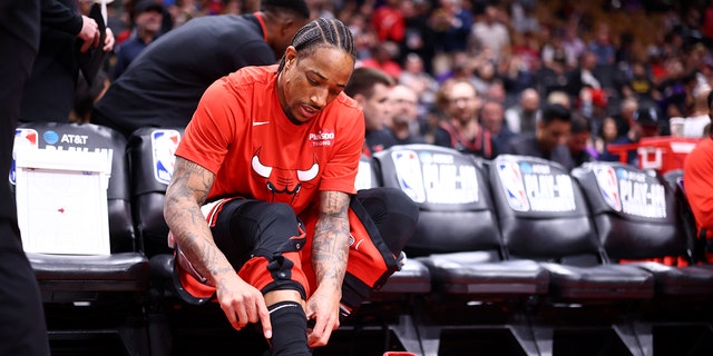 DeMar DeRozan of the Chicago Bulls puts on his sneakers before the Raptors game on April 12, 2023, at the Scotiabank Arena in Toronto, Canada.
