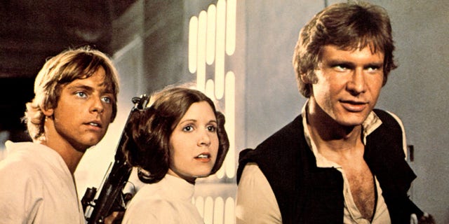 "Star Wars" (aka "Episode IV-A New Hope") lobby card, with three of the most famous characters in movie history. From left, Luke Skywalker (played by Mark Hamill), Princess Leia (Carrie Fisher) and Han Solo (Harrison Ford) 