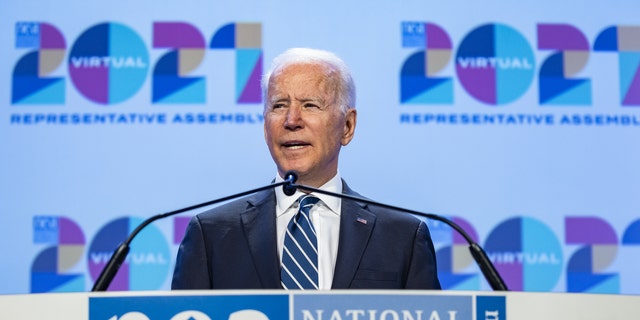 President Joe Biden speaks at the NEA