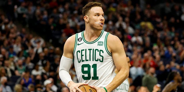 Blake Griffin, #91 of the Boston Celtics, rebounds the ball in the third quarter of the game against the Minnesota Timberwolves at Target Center on March 15, 2023, in Minneapolis, Minnesota. The Celtics defeated the Timberwolves 104-102. 