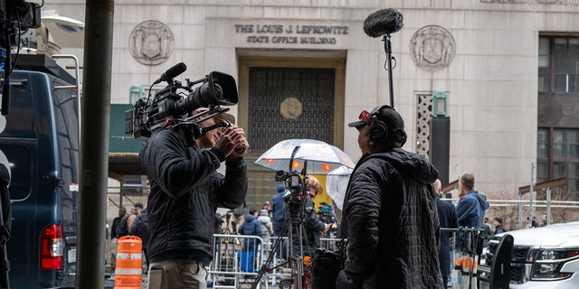 Media gather outside of New York County Criminal Courthouse as the nation waits for the possibility of an indictment against former president Donald Trump by the Manhattan District Attorney Alvin Bragg's office on March 27, 2023 in New York City. Bragg's office has been investigating alleged hush money payments by Trump to a porn star during the 2016 presidential campaign. Trump has called on supporters to take to the streets in protest if he is indicted. 
