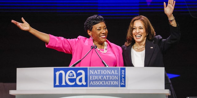 US Vice President Kamala Harris, right, waves with Becky Pringle, president of the National Education Association, at the National Education Association 2022 annual meeting and representative assembly in Chicago, Illinois, US, on Tuesday, July 5, 2022. Photographer: Tannen Maury/EPA/Bloomberg via Getty Images