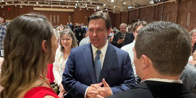 Florida Gov. Ron DeSantis greets GOP activists and leaders after headlining the New Hampshire GOP's annual fundraising dinner, on April 14, 2023, in Manchester, N.H. 