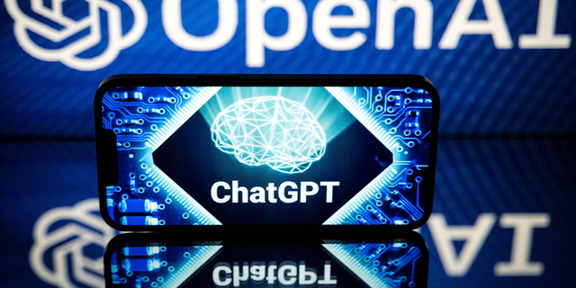 This picture taken on Jan. 23, 2023, shows screens displaying the logos of OpenAI and ChatGPT. - ChatGPT is a conversational artificial intelligence software application developed by OpenAI. 