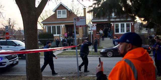 Chicago police walking through a crime scene.