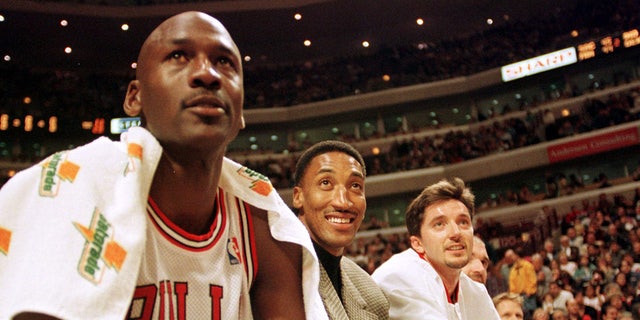 Michael Jordan and Scottie Pippen sit on the bench