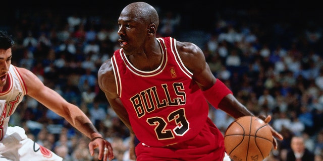 Michael Jordan dribbles the basketball