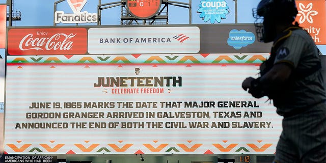 Message about Juneteenth displayed on scoreboard