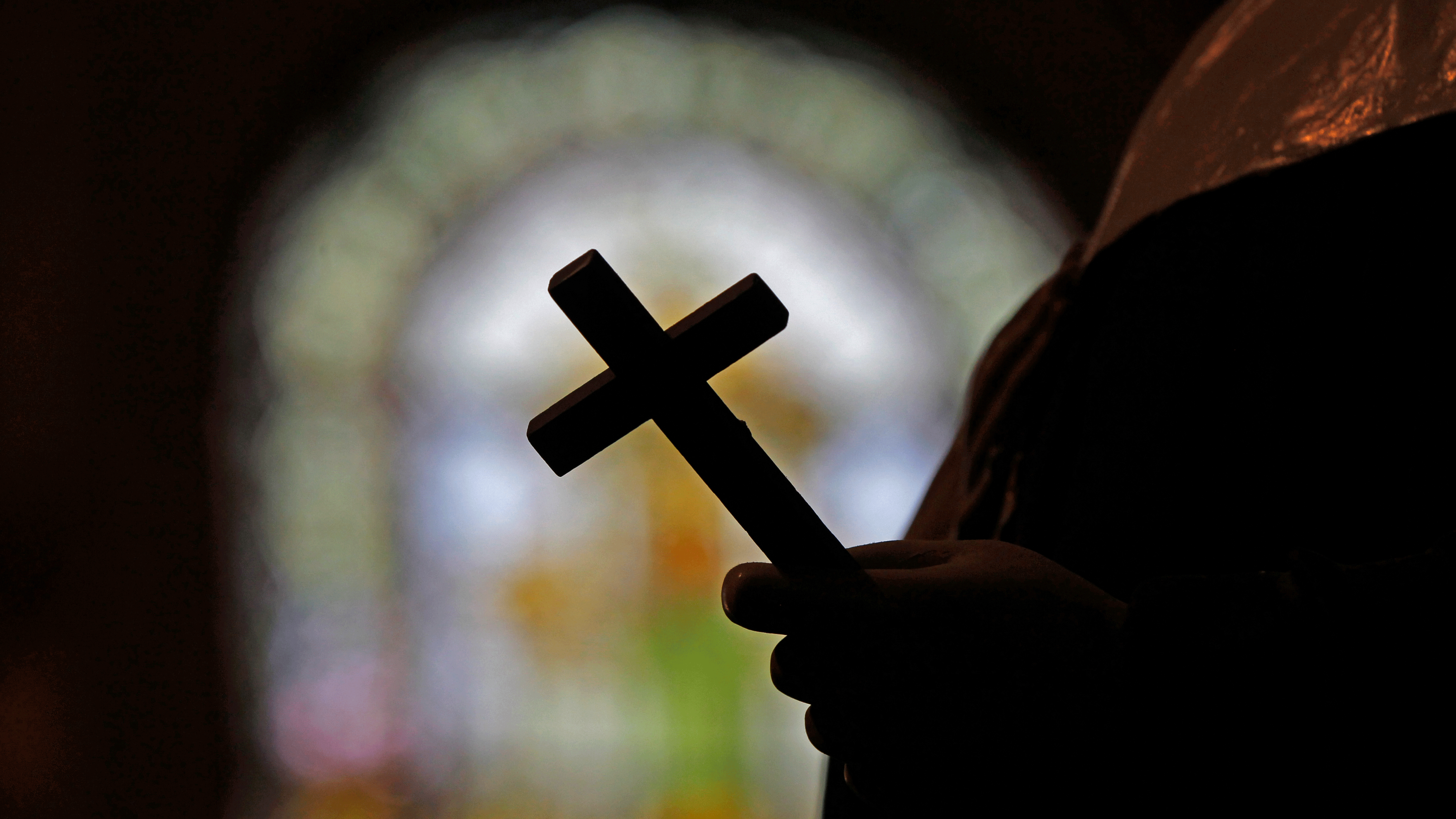 Priest holding cross