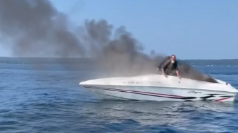 Video captures Michigan boaters diving into water before boat is engulfed in flames