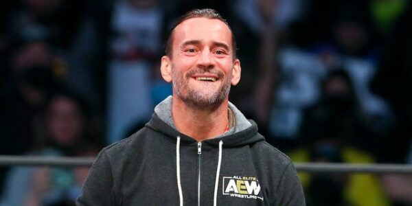 AEW star CM Punk poses with ‘trans rights are human rights’ sign at All In event