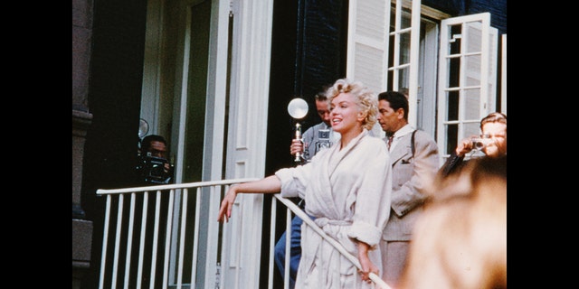 A still of Marilyn Monroe smiling while filming The Seven Year Itch in New York City