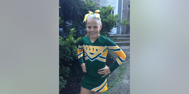 Mallory Grossman wearing a cheerleading uniform