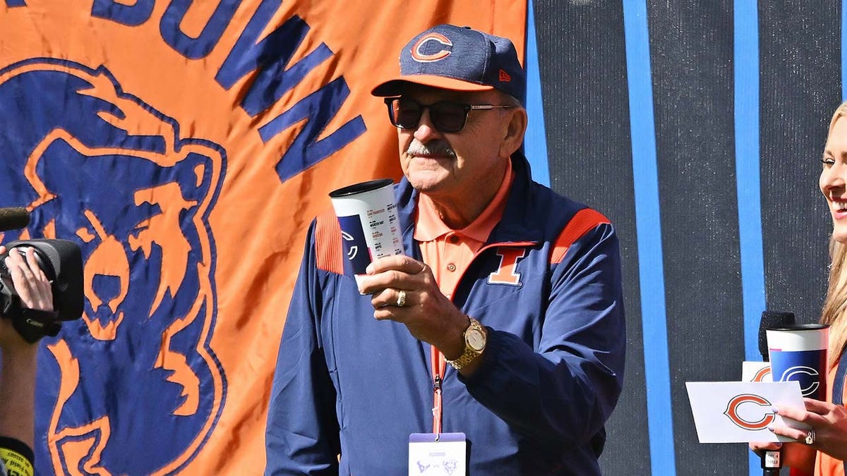 Former Chicago Bears player Dick Butkus watches a game
