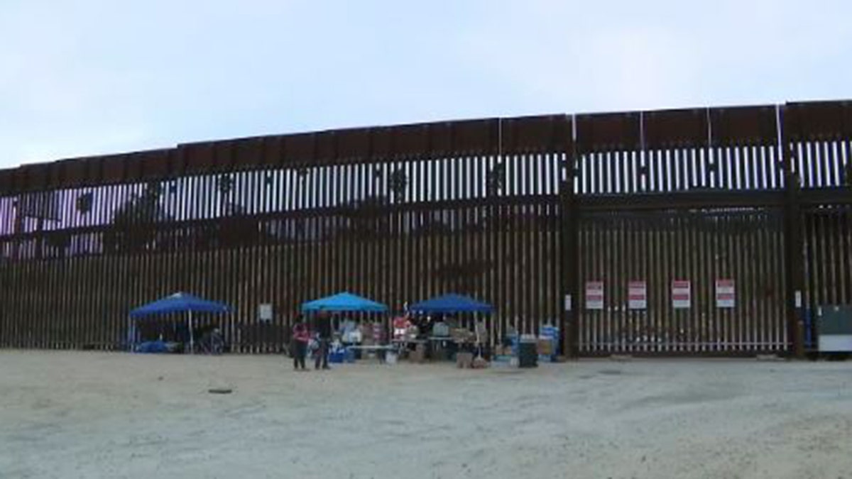 San Ysidro border fence with asylum seekers