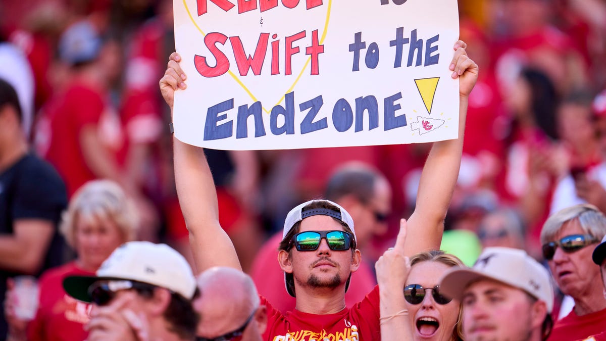 Fan holding sign Kansas City game