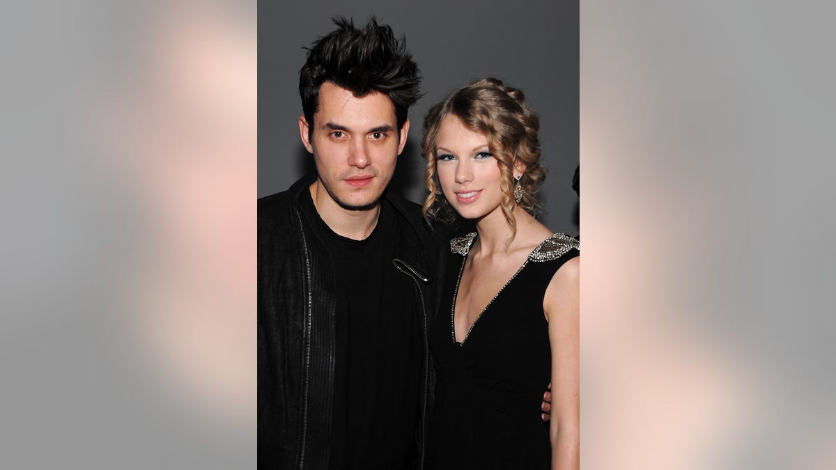 John Mayer and Taylor Swift posing together
