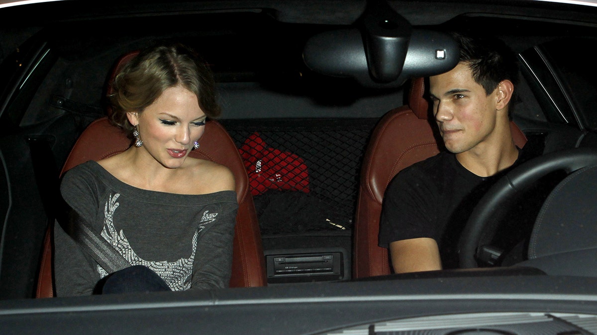 Taylor Swift and Taylor Lautner sitting in a car together