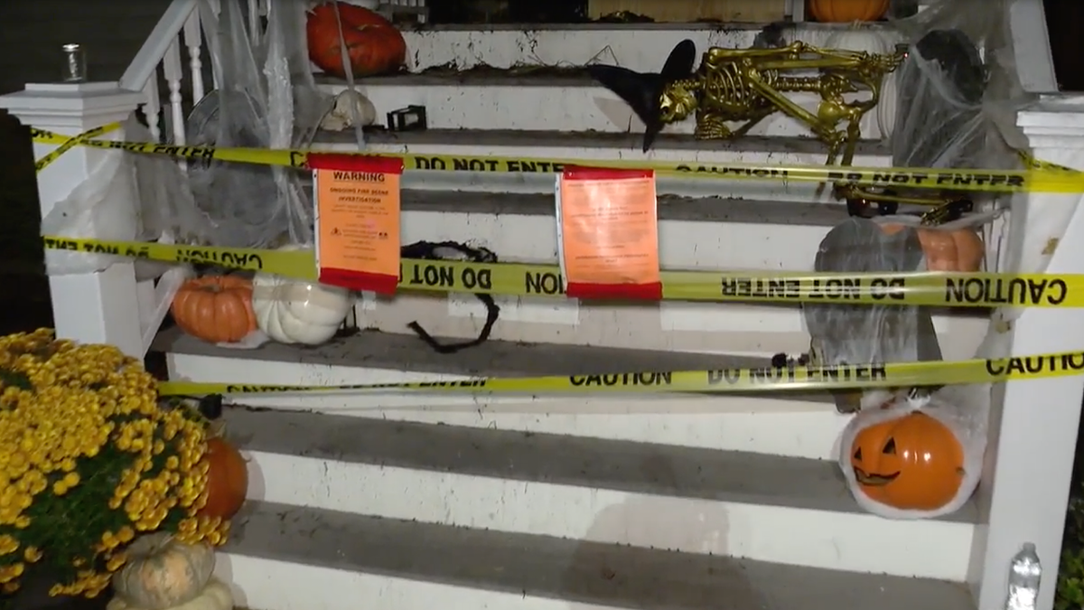 Chicago porch damaged by arson, caution tape around it