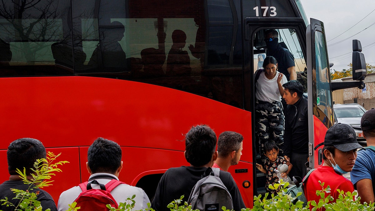 A bus drops off migrants in Chicago