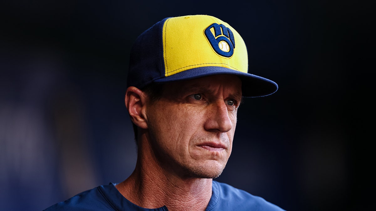 Craig Counsell looks on field