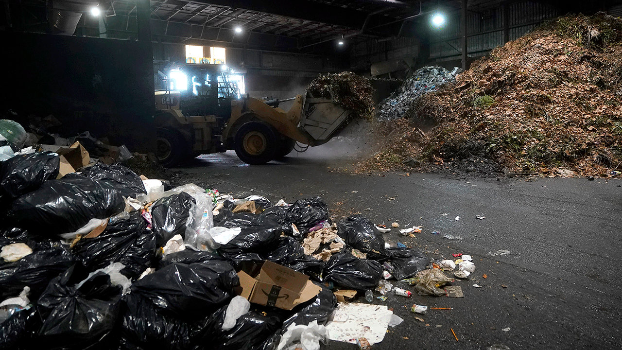 Shredded waste being piled up