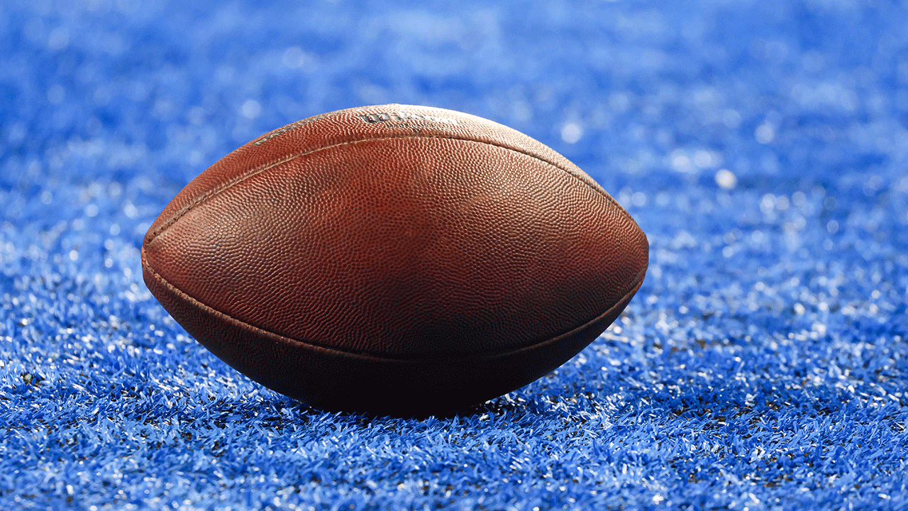 A close up of a football on a field