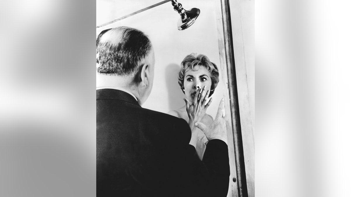 Alfred Hitchcock directing a scared Janet Leigh in the shower
