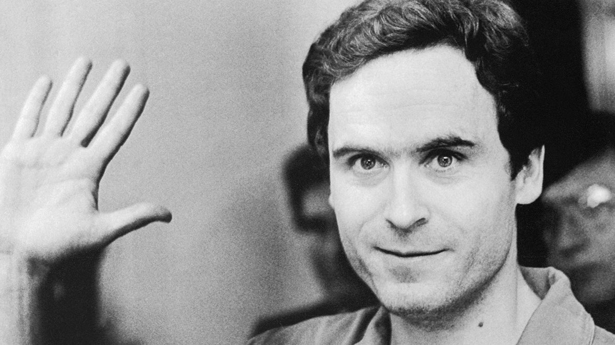 Ted Bundy holding his hand up