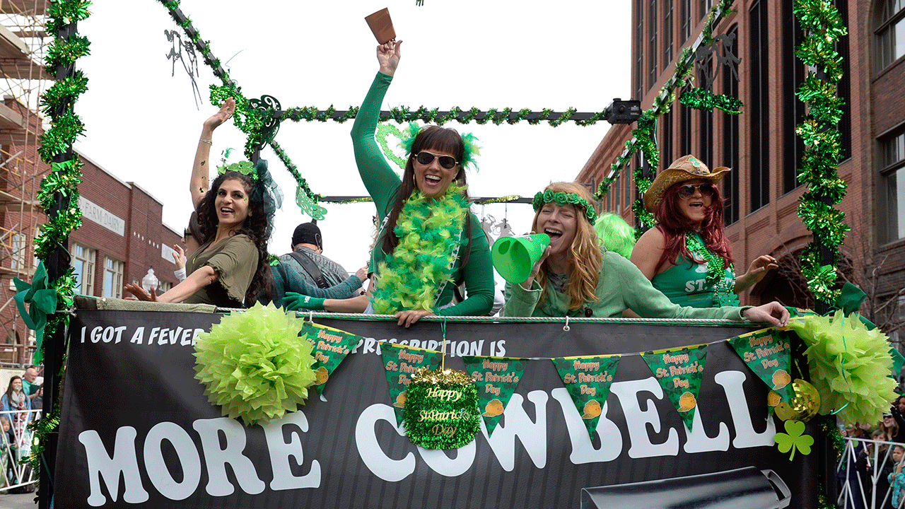 People on float at St. Patrick's Day parade in Denver